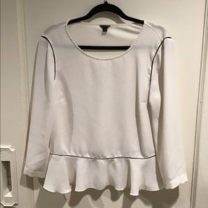 White top with black piping